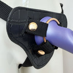 Nexus silicone  fun and love harness and silicone dildo set, with purple tease inserted zoomed in to show the gold hardware