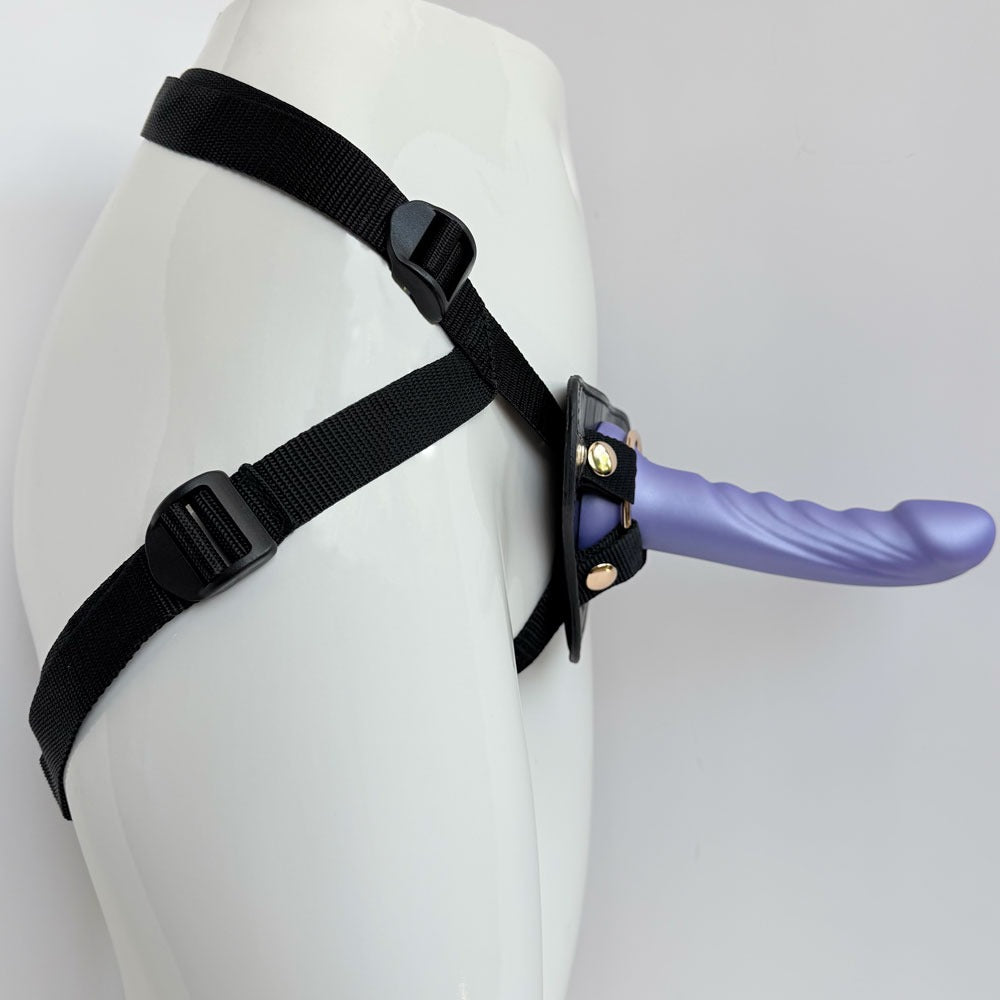 Nexus silicone  fun and love harness and silicone dildo set, with purple tease inserted from the side on a manequin
