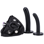 Black Bend over Beginners strap on kit close up of black velvet finish harness with included mini bullet vibe inserted into the built in vibe pocket and both dildos standing upright next to he harness