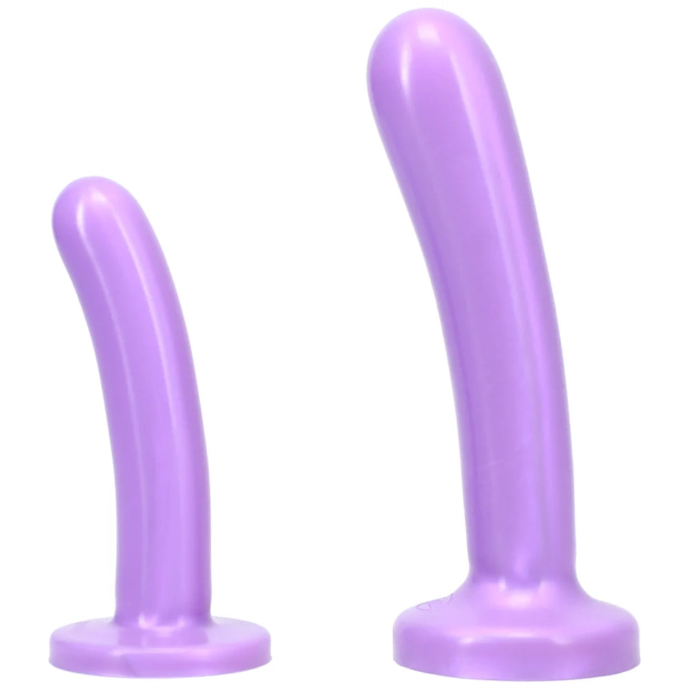 Purple Tantus Bend over Kit with 2 purple  silicone dildos standing on the flat base 