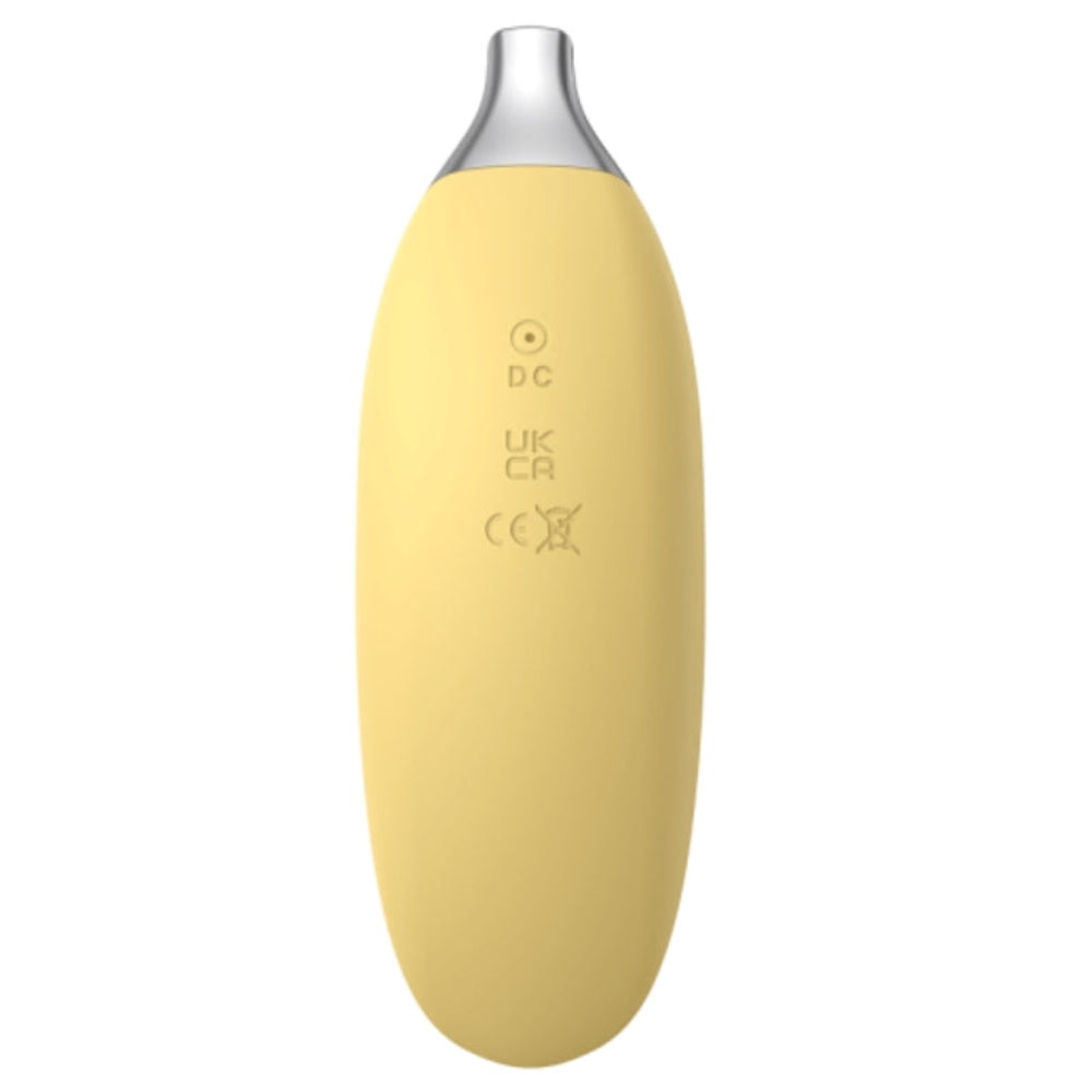 Top banana silicone banana shaped mini vibrator from the back, with pin charger port 