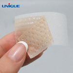 silicone scar tape by unnique, cut into a small piece and being peeled off backing