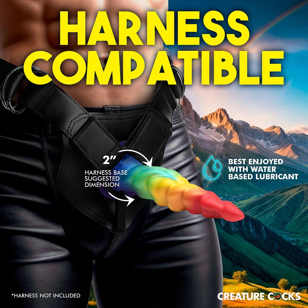 XR Creature Cocks Magic Rider rainbow tapered unicorn horn silicone fantasy dildo front in a harness on a human