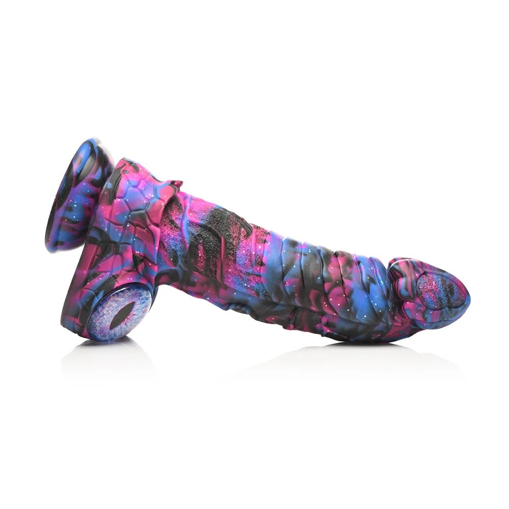 XR Brands Creature Cocks Alienoid Pink, black, blue and glitter silicone fantasy dildo with eye balls for testes horizontal to the ground from the side