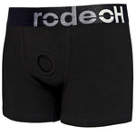 Black boxer-style harness with a circular O-ring at the front and the brand name 'Rodeoh' displayed on the waistband.