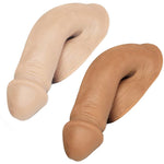 Two Mr. Limpy realistic-looking soft packers in caramel and vanilla colors, made of a flesh-like material with a matte finish.